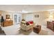 Spacious living room with carpet, a ceiling light, sliding doors and several pieces of furniture at 1386 Sheffield Glen Ne Way, Atlanta, GA 30329