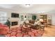Inviting living room featuring a fireplace, hardwood floors, and stylish decor at 1386 Sheffield Glen Ne Way, Atlanta, GA 30329