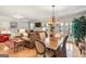 Inviting living room featuring hardwood floors, neutral paint, wood table, and access to outdoor seating at 1386 Sheffield Glen Ne Way, Atlanta, GA 30329