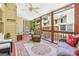 Cozy screened porch with comfortable wicker furniture and views of the surrounding area at 1386 Sheffield Glen Ne Way, Atlanta, GA 30329