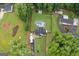 Aerial view shows this cozy home's fenced yard, pool, and RV parking at 5745 Westwood Dr, Cumming, GA 30040