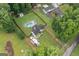 Aerial view showing the house nestled between green trees at 5745 Westwood Dr, Cumming, GA 30040