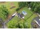 Aerial view of home with fenced yard, RV parking, and in-ground pool at 5745 Westwood Dr, Cumming, GA 30040