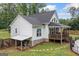 Side view of house showing the back patio, backyard and pool at 5745 Westwood Dr, Cumming, GA 30040