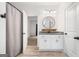 Bathroom with white vanity, granite countertop, and modern fixtures at 5745 Westwood Dr, Cumming, GA 30040