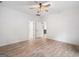Bedroom with wood floors and ceiling fan at 5745 Westwood Dr, Cumming, GA 30040