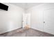 Bedroom showcasing neutral carpet, white walls and doors, and ample space to make it your own at 5745 Westwood Dr, Cumming, GA 30040