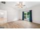 Bedroom featuring wood-look floors, ceiling fan, and view of the pool at 5745 Westwood Dr, Cumming, GA 30040