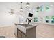 Spacious kitchen with granite countertops, stainless steel appliances, and an island overlooking the living room at 5745 Westwood Dr, Cumming, GA 30040