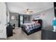 This charming bedroom has a ceiling fan and carpeted floors at 1195 New Hope Rd, Locust Grove, GA 30248
