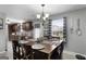 Cozy dining room with a wooden table, kitchen access, and natural lighting at 1195 New Hope Rd, Locust Grove, GA 30248