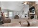 Spacious living room with a stone fireplace and a cozy seating arrangement at 1195 New Hope Rd, Locust Grove, GA 30248