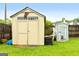 Backyard featuring two sheds in the yard and a wooden fence at 1195 New Hope Rd, Locust Grove, GA 30248