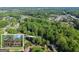 Aerial view of the property surrounded by lush greenery and beautiful landscaping at 4680 Brighton Lake Dr, Cumming, GA 30040