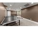 Basement with a ping pong table and potential for recreational activities at 4680 Brighton Lake Dr, Cumming, GA 30040