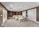 Basement living room with carpet, and a large sectional sofa at 4680 Brighton Lake Dr, Cumming, GA 30040