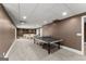 Basement featuring a ping pong table, carpet, and a sectional in the background at 4680 Brighton Lake Dr, Cumming, GA 30040