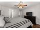Bedroom with hardwood floors, ceiling fan, and dark wood furniture at 4680 Brighton Lake Dr, Cumming, GA 30040