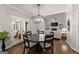 Cozy dining area with hardwood floors, natural light, and adjacent living room at 4680 Brighton Lake Dr, Cumming, GA 30040