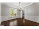 Elegant dining room featuring hardwood floors and modern chandelier at 4680 Brighton Lake Dr, Cumming, GA 30040