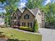 Charming two-story brick home with side-entry garage, mature trees and landscaped yard at 4680 Brighton Lake Dr, Cumming, GA 30040