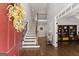 Welcoming foyer with hardwood floors, high ceilings and an elegant staircase at 4680 Brighton Lake Dr, Cumming, GA 30040