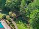 Well-maintained community green space with a picturesque bridge over a creek and walkway access at 4680 Brighton Lake Dr, Cumming, GA 30040