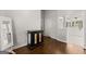 Hallway leading to the bathroom with white cabinets and bright lighting at 4680 Brighton Lake Dr, Cumming, GA 30040