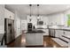 Spacious kitchen with island, stainless steel appliances, and pendant lighting at 4680 Brighton Lake Dr, Cumming, GA 30040