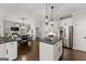 Open kitchen with island and stainless steel appliances at 4680 Brighton Lake Dr, Cumming, GA 30040