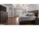 A spacious main bedroom with a tray ceiling, hardwood floors, and ample closet space at 4680 Brighton Lake Dr, Cumming, GA 30040