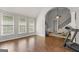 A well lit sunroom featuring hardwood floors and a view of the backyard at 4680 Brighton Lake Dr, Cumming, GA 30040