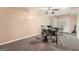 Versatile basement space with carpet, neutral walls, and double doors, perfect for recreational activities at 5940 Plantation Dr, Roswell, GA 30075