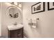 Modern bathroom with stylish vanity, sink, and framed mirror at 5940 Plantation Dr, Roswell, GA 30075