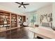Spacious bedroom features built-in shelving, hardwood floors and a large window at 5940 Plantation Dr, Roswell, GA 30075