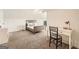 Neutral bedroom features a desk with a chair and carpeted floors at 5940 Plantation Dr, Roswell, GA 30075