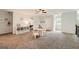 Expansive bonus room with carpet, neutral walls, featuring a play area, storage, and a cozy atmosphere at 5940 Plantation Dr, Roswell, GA 30075