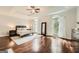 Bright main bedroom showcasing large windows, trey ceiling, and hardwood floors at 5940 Plantation Dr, Roswell, GA 30075