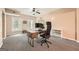 Bright office space with a modern desk setup, neutral walls, and large windows, creating a productive environment at 5940 Plantation Dr, Roswell, GA 30075
