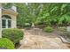 Spacious outdoor patio featuring stone flooring, fireplace, and dining area, perfect for entertaining guests at 5940 Plantation Dr, Roswell, GA 30075