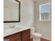 Cozy powder room featuring a white vanity with wood accents and tile flooring at 1300 Hopkins Dr, Decatur, GA 30033