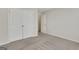 A clean, carpeted bedroom with a closet and neutral walls, offering a blank canvas for personalization at 1300 Hopkins Dr, Decatur, GA 30033