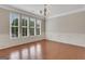 Elegant dining room featuring hardwood floors, decorative molding, and ample natural light at 1300 Hopkins Dr, Decatur, GA 30033