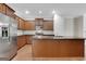 Well-equipped kitchen with stainless steel appliances, wood cabinets, and a large island at 1300 Hopkins Dr, Decatur, GA 30033