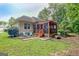 Backyard featuring a screened porch and a well-maintained lawn at 835 Virginia Parks, Fayetteville, GA 30215