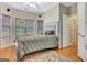 Cozy bedroom featuring a comfortable bed, natural light, and hardwood floors at 835 Virginia Parks, Fayetteville, GA 30215