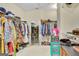 Large walk-in closet with an abundance of storage space for clothes, shoes and accessories at 835 Virginia Parks, Fayetteville, GA 30215