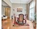 Bright dining room featuring large windows, hardwood floors, and elegant furnishings at 835 Virginia Parks, Fayetteville, GA 30215