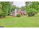 Attractive brick home with a spacious yard and lush greenery at 835 Virginia Parks, Fayetteville, GA 30215