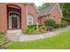 Close-up of a well-kept brick home and front yard landscaping at 835 Virginia Parks, Fayetteville, GA 30215